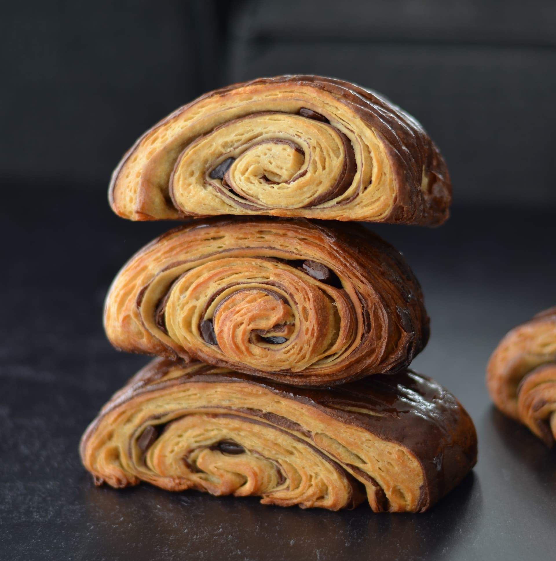 Stacked laminated pastries with chocolate and golden layers